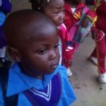 ONETrack International - Cameroon child in blue