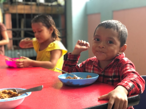 ONETrack International - Honduras children eating